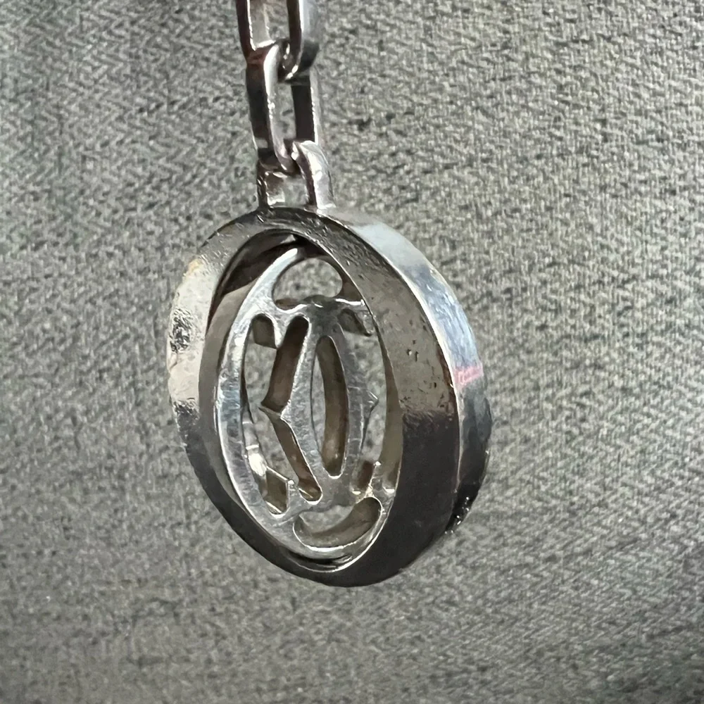 Cartier Silvertone stainless steel pivoting Double C key ring